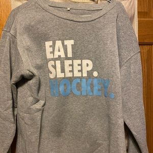 Hockey sweatshirt size Large, women’s.